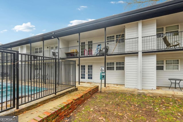 exterior space featuring a fenced in pool