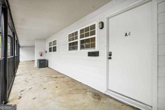 doorway to property with central air condition unit