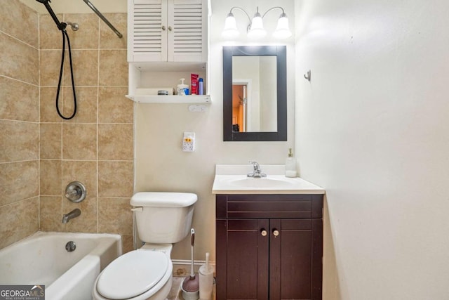 full bathroom with vanity, toilet, and tiled shower / bath