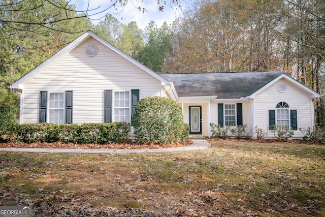 single story home featuring a front yard