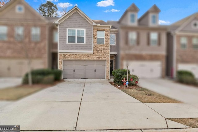 townhome / multi-family property featuring a garage