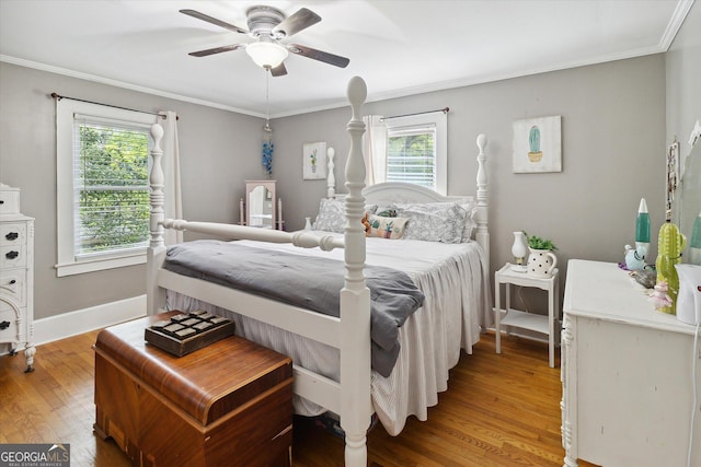 bedroom with ceiling fan, wood-type flooring, and ornamental molding