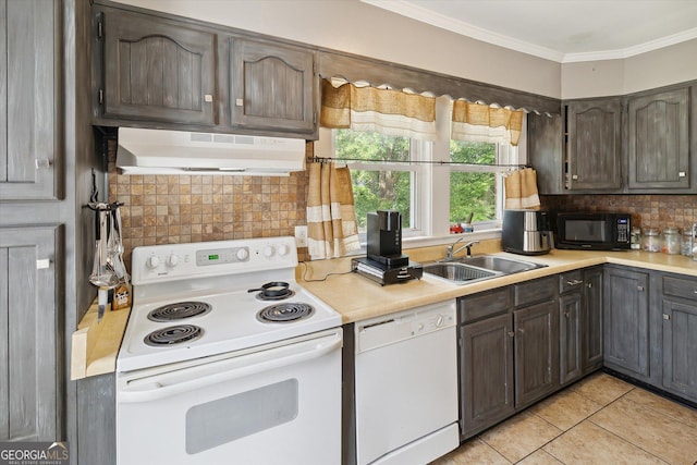 kitchen with ornamental molding, white appliances, sink, range hood, and light tile patterned flooring