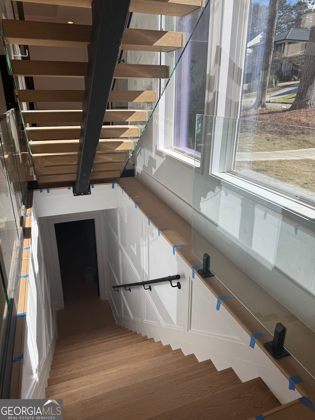 stairway with wood finished floors