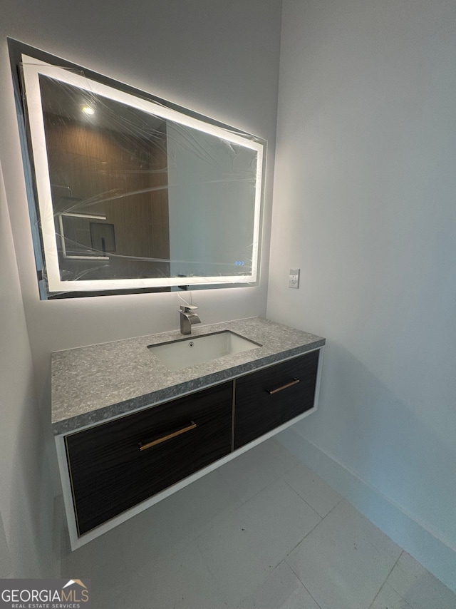 bathroom with tile patterned floors and vanity
