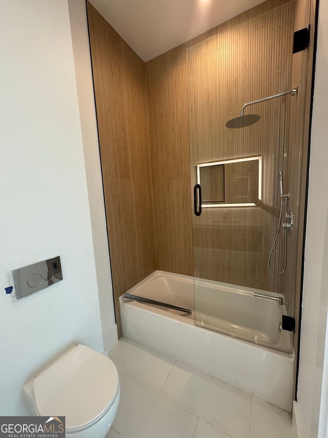 full bathroom with tile patterned flooring, toilet, and enclosed tub / shower combo