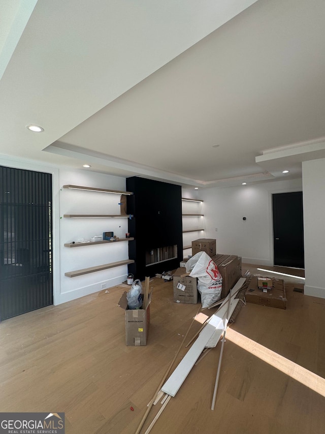 unfurnished living room with recessed lighting and wood finished floors