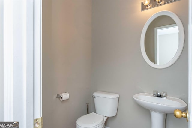 bathroom with toilet and sink