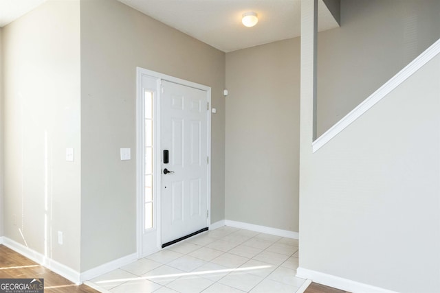 entryway featuring light tile patterned floors