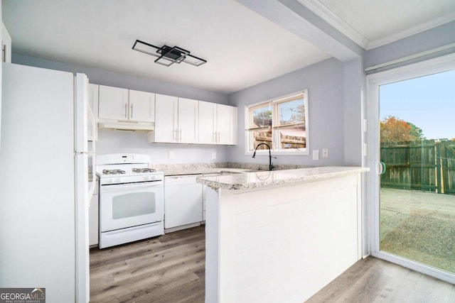 kitchen with kitchen peninsula, white cabinets, white appliances, and light wood-type flooring