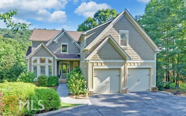 craftsman house with a garage