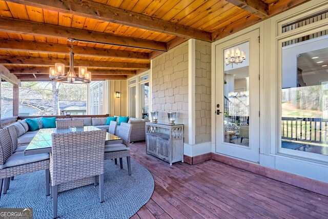 sunroom with a notable chandelier, wood ceiling, and beamed ceiling