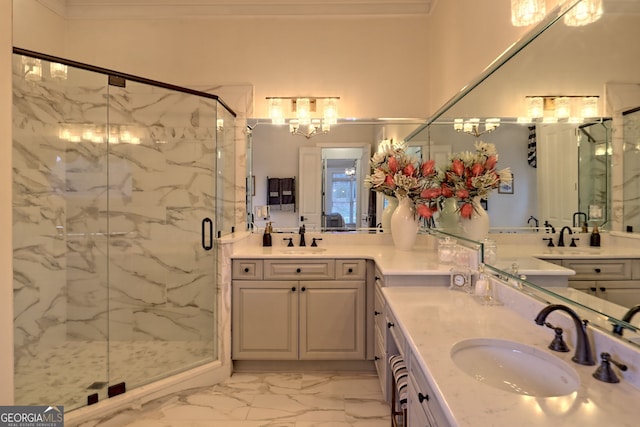 bathroom featuring a shower with door and vanity