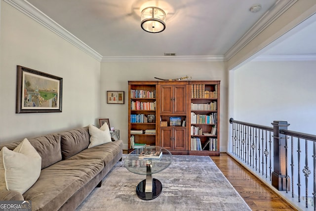 living room featuring ornamental molding and hardwood / wood-style flooring