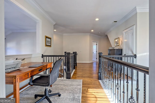 office space with light wood-type flooring and crown molding