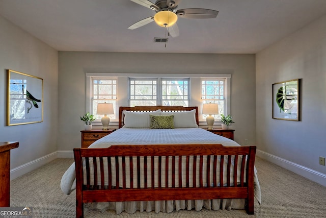 carpeted bedroom with ceiling fan