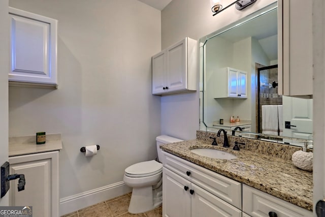 bathroom featuring a shower with door, tile patterned floors, vanity, and toilet