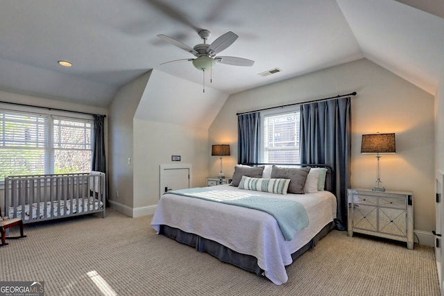 carpeted bedroom with lofted ceiling and ceiling fan