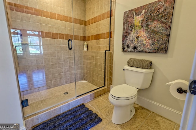 bathroom with toilet, a shower with door, and tile patterned flooring