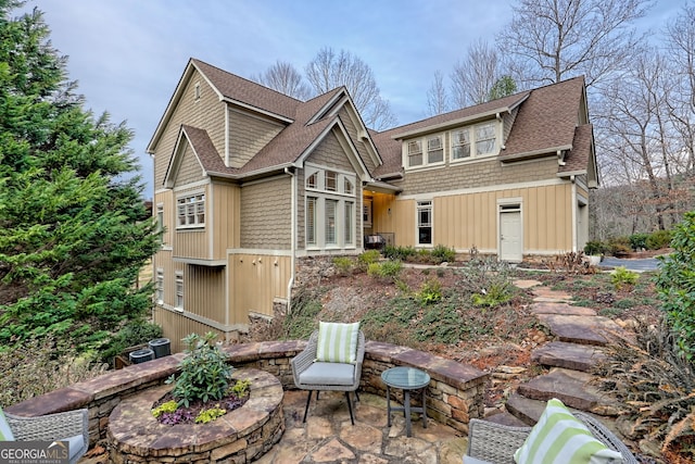 back of house with a patio area and central AC unit