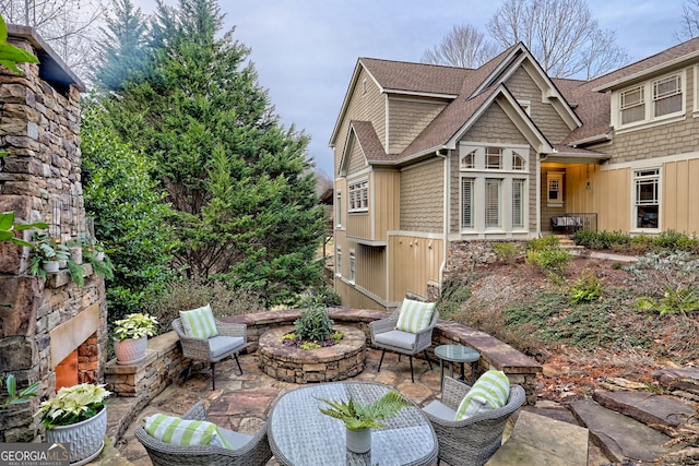 view of patio / terrace with an outdoor stone fireplace