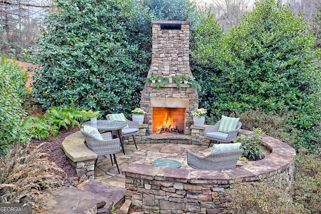 view of patio / terrace with an outdoor stone fireplace