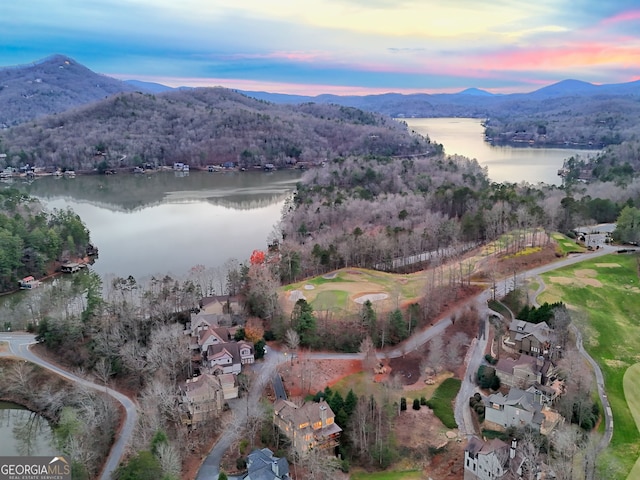 aerial view at dusk with a water and mountain view