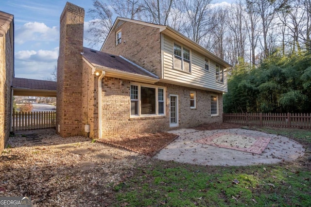 back of property featuring a patio