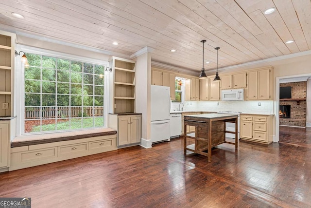 kitchen featuring white appliances, cream cabinetry, crown molding, hanging light fixtures, and wood ceiling