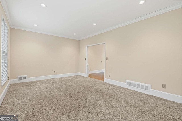 empty room with carpet and ornamental molding