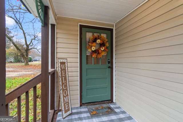 doorway to property with a porch