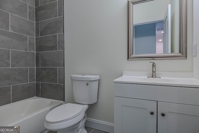 full bathroom with tiled shower / bath, tile patterned flooring, vanity, and toilet