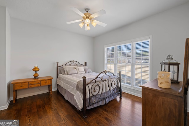 bedroom with dark wood-style floors, a raised ceiling, visible vents, access to outside, and baseboards