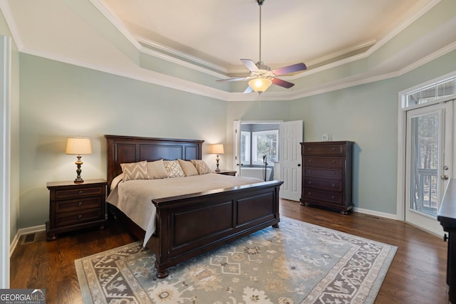 bathroom with visible vents, two vanities, a sink, and toilet