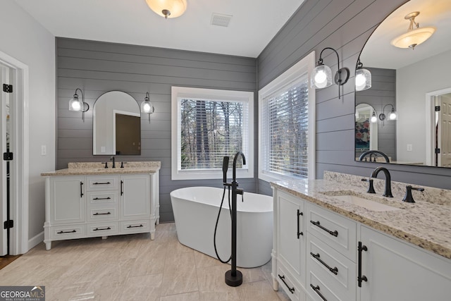 bedroom featuring ceiling fan, a closet, dark wood finished floors, and baseboards