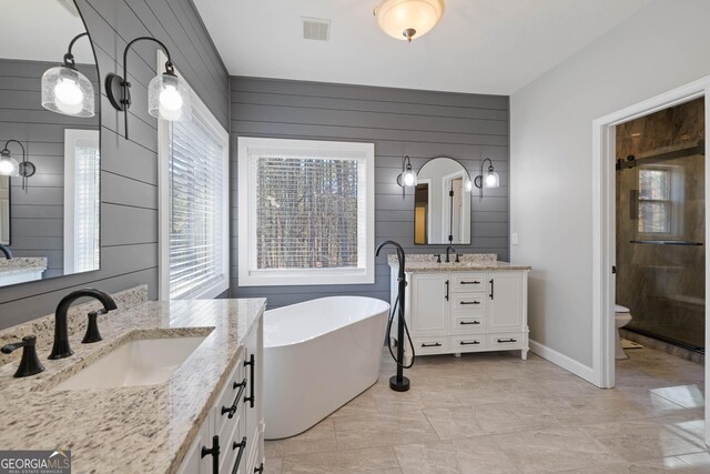 kitchen with sink, white appliances, a kitchen island, decorative backsplash, and light tile patterned flooring