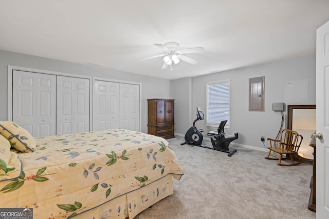 kitchen with light tile patterned floors, a peninsula, white appliances, baseboards, and a kitchen breakfast bar