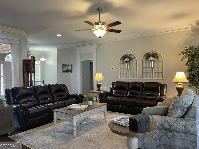 living room with ornamental molding, hardwood / wood-style floors, and ceiling fan