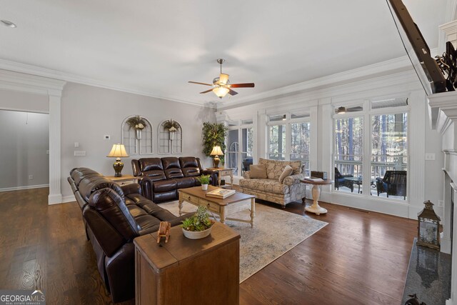 living room featuring ceiling fan, ornamental molding, and dark hardwood / wood-style floors