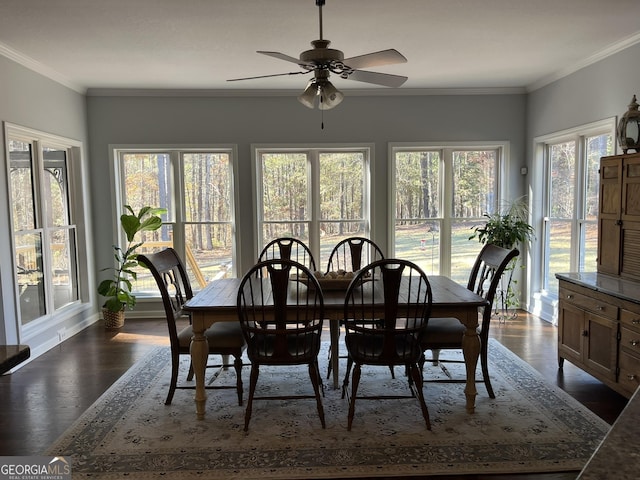 dining space featuring ceiling fan, crown molding, dark hardwood / wood-style floors, and a healthy amount of sunlight