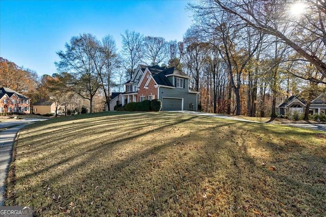 view of side of home with a garage and a lawn