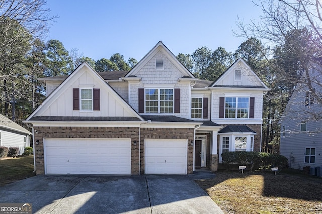 view of front of home with central AC and a garage