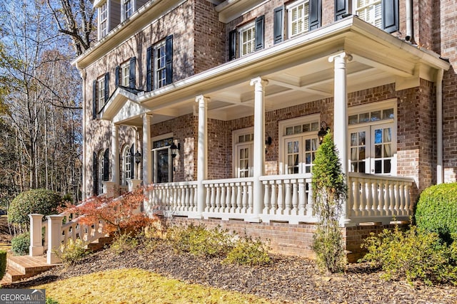 doorway to property featuring a porch