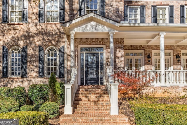 property entrance with covered porch