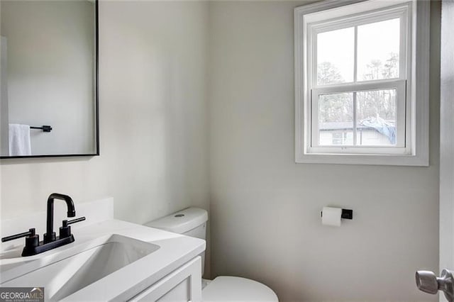 bathroom with vanity and toilet