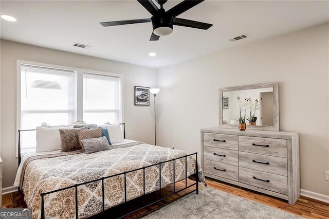 bedroom featuring hardwood / wood-style flooring and ceiling fan