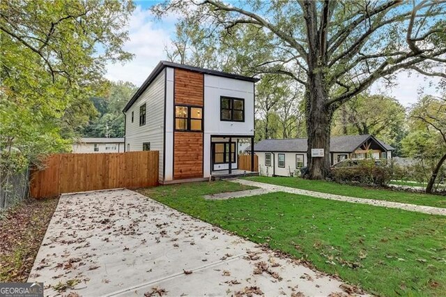 contemporary house with a front lawn