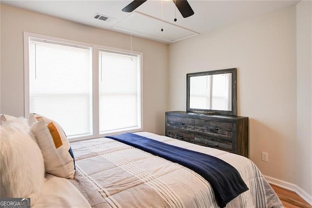 bedroom with wood-type flooring and ceiling fan