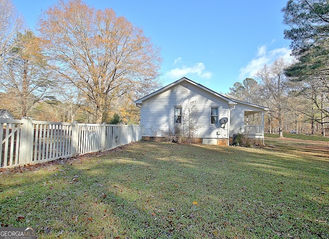 view of property exterior featuring a lawn