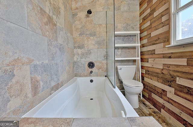 bathroom with a bathtub and toilet